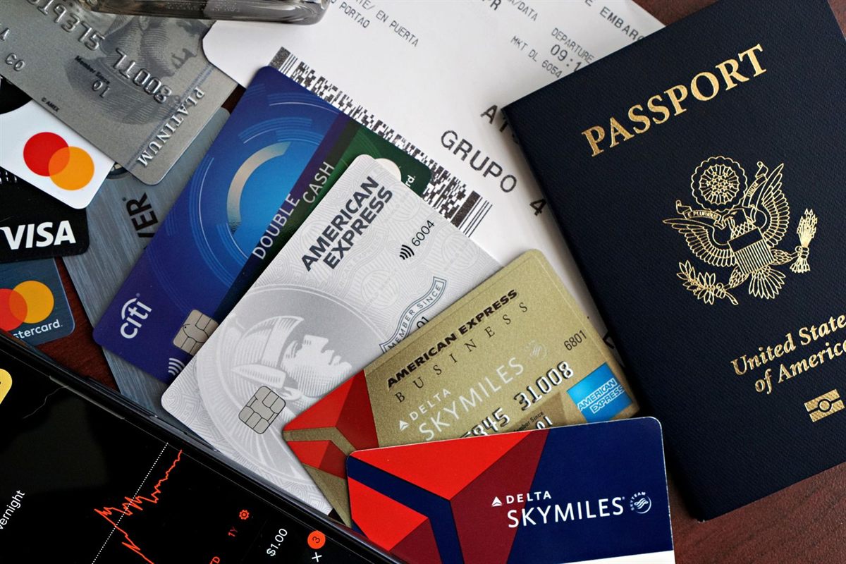 A U.S. passport on top of several credit cards and airline loyalty cards