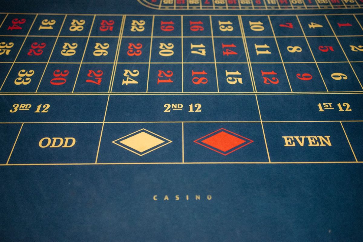 Close-up of a roulette table layout with numbers, odd and even boxes